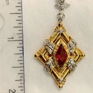 14k white and yellow gold pendant with diamonds and a red spinel